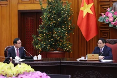 Thủ tướng Phạm Minh Chính tiếp ông Choi Joo Ho, Tổng Giám đốc Tổ hợp Samsung Việt Nam. (Ảnh: Dương Giang/TTXVN)