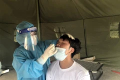 Test nhanh COVID-19. (Ảnh: Nguyên Linh/TTXVN)