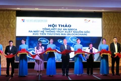 Lễ ra mắt Hệ thống Truy xuất nguồn gốc xúc tiến thương mại áp dụng công nghệ chuỗi khối-Blockchain. (Ảnh: PV/Vietnam+)