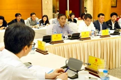 Phó Tổng Giám đốc Bảo hiểm Xã hội Việt Nam Phạm Lương Sơn phát biểu. (Ảnh: Dương Ngọc/TTXVN)