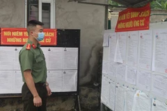 ​Nơi niêm yết danh sách ứng cử viên, danh sách cử tri tại một khu vực bỏ phiếu trên địa bàn xã Thống Nhất, huyện Hạ Lang, tỉnh Cao Bằng. (Ảnh: Chu Hiệu/TTXVN) 