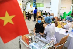 Sáng 29/7/2021, quận Hoàn Kiếm thực hiện tiêm chủng vaccine ngừa COVID-19 tại các phường Hàng Bông, Hàng Trống, Trần Hưng Đạo, Cửa Nam... (Ảnh: Thành Đạt/TTXVN) 