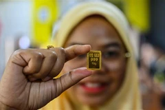 Vàng miếng được bán tại Kota Bharu, bang Kelantan, Malaysia. (Ảnh: AFP/TTXVN) 