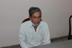 Đối tượng Trần Văn Phi tại cơ quan công an. (Ảnh: TTXVN phát) 