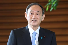 Thủ tướng Nhật Bản Suga Yoshihide phát biểu với báo giới tại Tokyo ngày 12/4/2021. (Nguồn: AFP/TTXVN) 
