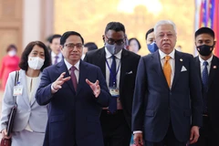 Thủ tướng Phạm Minh Chính và Thủ tướng Malaysia Dato’ Sri Ismail Sabri bin Yaakob. (Ảnh: Dương Giang/TTXVN) 
