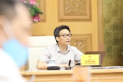 Phó Thủ tướng Vũ Đức Đam chủ trì cuộc họp. (Ảnh: Văn Điệp/TTXVN) 