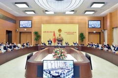 Ủy ban Thường vụ Quốc hội biểu quyết thông qua dự thảo Nghị quyết hướng dẫn thi hành Nội quy kỳ họp Quốc hội. (Ảnh: Doãn Tấn/TTXVN)