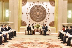 Phó Thủ tướng Chính phủ Hồ Đức Phớc hội kiến Bí thư Khu ủy Quảng Tây, Trung Quốc Lưu Ninh. (Ảnh: Công Tuyên/TTXVN)