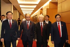 Tổng Bí thư Nguyễn Phú Trọng cùng Chủ tịch nước Nguyễn Xuân Phúc, Thủ tướng Phạm Minh Chính và Chủ tịch Quốc hội Vương Đình Huệ dự bế mạc Kỳ họp thứ 11, Quốc hội khóa XIV. (Ảnh: Trí Dũng/TTXVN)