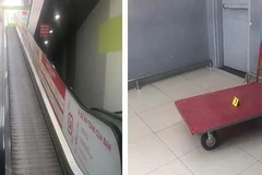 Xe đẩy chở hàng trên thang cuốn trượt xuống gây chết người