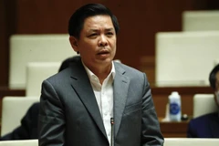 Bộ trưởng Bộ Giao thông Vận tải Nguyễn Văn Thể giải trình làm rõ các vấn đề có liên quan. (Ảnh: Minh Đức/TTXVN) 