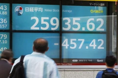 Chỉ số Nikkei 225 của Nhật Bản giảm điểm trong khi chỉ số Hang Seng của Hong Kong tăng điểm trong phiên 21/12. (Ảnh: Kyodo/TTXVN) 