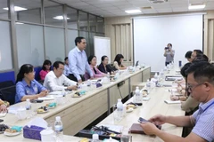 Quang cảnh buổi làm việc của Bộ Lao động, Thương binh và Xã hội với Công ty trách nhiệm hữu hạn PouYuen Việt Nam. (Ảnh: Thanh Vũ/TTXVN)