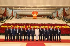 Các đại biểu chụp ảnh chung, sáng 27/1/2021. (Nguồn: TTXVN) 