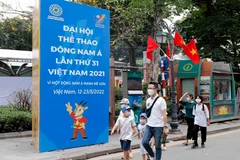 Trong ảnh: Biểu ngữ chào SEA Games 31 trên phố Lê Thạch. Ảnh: Trần Việt - TTXVN 