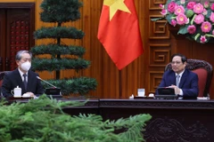 Thủ tướng Phạm Minh Chính tiếp Đại sứ Hùng Ba. (Ảnh: Dương Giang/TTXVN) 