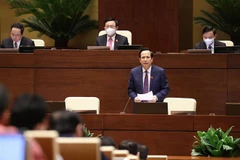 Bộ trưởng Bộ Lao động Thương binh và Xã hội Đào Ngọc Dung giải trình ý kiến đại biểu Quốc hội nêu. (Ảnh: Dương Giang/TTXVN) 