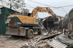 Hiện trường cưỡng chế giải tỏa. (Ảnh: TTXVN phát) 