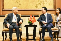 Chủ tịch nước Võ Văn Thưởng tiếp Chủ tịch AIIB Kim Lập Quần. (Ảnh: Tiến Trung/TTXVN)
