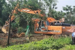 Cưỡng chế, giải phóng mặt bằng Dự án Khu Đô thị Mới Nam Vĩnh Yên. (Ảnh: Nguyễn Trọng Lịch/TTXVN)