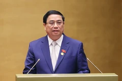 Thủ tướng Phạm Minh Chính trình bày Báo cáo Kết quả thực hiện Kế hoạch Phát triển Kinh tế-Xã hội năm 2023; dự kiến Kế hoạch Phát triển Kinh tế-Xã hội năm 2024. (Ảnh: Dương Giang/TTXVN)