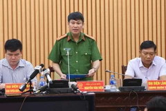 Đại tá Nguyễn Văn Viện, Phó Giám đốc Công an Thành phố Hà Nội thông tin nội dung cho báo chí. (Ảnh: Doãn Tấn/TTXVN)