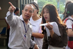 Thí sinh dự thi tại điểm thi Đại học Khoa học tự nhiên - Đại học Quốc gia Thành phố Hồ Chí Minh. (Nguồn: TTXVN phát)