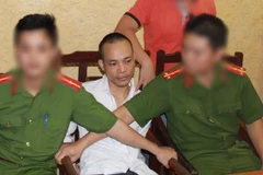 Bắt giữ Lê Văn Thọ. (Nguồn: TTXVN phát)