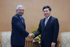 Phó Thủ tướng, Bộ trưởng Ngoại giao Phạm Bình Minh tiếp ông Kamal Malhotra, Điều phối viên thường trú, Trưởng Đại diện UNDP tại Việt Nam. (Ảnh: Nguyễn Khang/TTXVN)