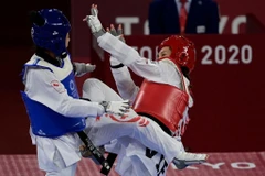 Vận động viên Kim Tuyền (giáp đỏ) áp đảo đối thủ. (Ảnh: Getty Images) 