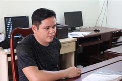 Đối tượng Phi tại cơ quan công an. (Ảnh: TTXVN phát)