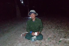 Đối tượng Nguyễn Văn Hoàng tại thời điểm bị bắt giữ. (Ảnh: TTXVN phát)