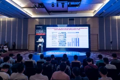 Phó Giáo sư, Tiến sỹ Trần Minh Tuấn - Phó Viện trưởng phụ trách Viện Chiến lược Thông tin và Truyền thông phát biểu tại sự kiện. (Ảnh: Minh Sơn/Vietnam+)