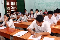 Thí sinh làm bài thi môn Địa lý. (Ảnh: Trần Lê Lâm/TTXVN)