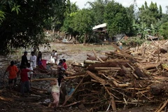 Cảnh tàn phá ở thành phố Iligan, đảo Mindanao ngày 17/12 sau khi cơn bão Washi tràn qua. (Nguồn: AFP/TTXVN)