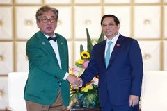 Thủ tướng Phạm Minh Chính tiếp Chủ tịch Ủy ban về Trung hoà Carbon và Tăng trưởng xanh Hàn Quốc Kim Sang-hyup. (Ảnh: Dương Giang/TTXVN)