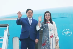 Thủ tướng Phạm Minh Chính và Phu nhân. (Ảnh: Dương Giang/TTXVN)