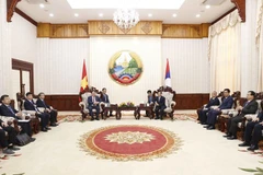 Quang cảnh buổi hội kiến giữa Chủ tịch Quốc hội Vương Đình Huệ và Thủ tướng Lào Phankham Viphavanh. (Ảnh: Doãn Tấn/TTXVN