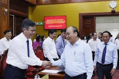 Chủ tịch nước Nguyễn Xuân Phúc với các đại biểu dự buổi làm việc. (Ảnh: Thống Nhất/TTXVN)