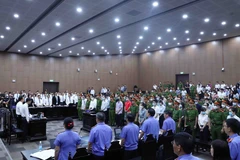 Phiên tòa xét xử 54 bị cáo trong vụ “chuyến bay giải cứu.” (Ảnh: Phạm Kiên/TTXVN) 