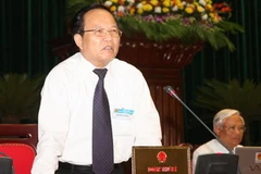 Bộ trưởng Bộ Văn hoá, Thể thao và Du lịch Hoàng Tuấn Anh trả lời chất vấn của đại biểu Quốc hội. (Ảnh: Nguyên Dân/TTXVN)