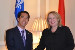 Đại sứ Việt Nam tại Canada Tô Anh Dũng và bà St-Pierre Christine - Bộ trưởng Ngoại giao và Pháp ngữ Quebec. (Ảnh: Lê Hoàng/Vietnam+)
