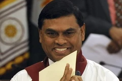 Em trai của Tổng thống Rajapakse là Basil Rajapakse tuyên thệ chức Bộ trưởng Kinh tế. (Ảnh: Getty Images)