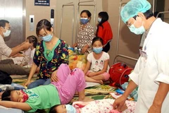 Quá tải bệnh nhân cúm A/H1N1(Ảnh: Hữu Oai/TTXVN)