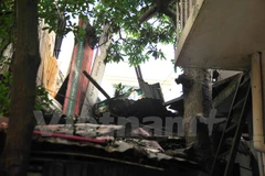 Hiện trường vụ rơi bê tông vào nhà dân ngày 19/2 (Ảnh: Võ Phương/Vietnam+)