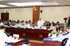 Các đại biểu tham gia thảo luận tại buổi tọa đàm. (Ảnh: Thanh Vũ/TTXVN)