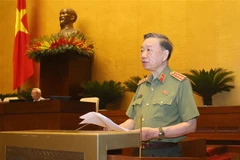 Bộ trưởng Bộ Công an Tô Lâm trình bày Tờ trình về dự án Luật Cư trú (sửa đổi). (Ảnh: Doãn Tấn/TTXVN)