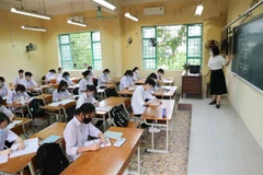 Học sinh trong lớp không bắt buộc đeo khẩu trang nhưng phải đeo trong giờ ra chơi. (Ảnh: Thanh Tùng/TTXVN)