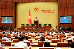 Quốc hội thảo luận ở hội trường về dự thảo Nghị quyết về việc lấy phiếu tín nhiệm, bỏ phiếu tín nhiệm đối với người giữ chức vụ do Quốc hội, Hội đồng nhân dân bầu hoặc phê chuẩn (sửa đổi). (Ảnh: Doãn Tấn/TTXVN)
